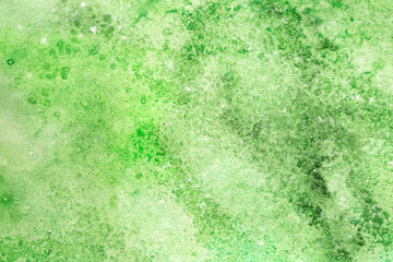 Warm summer grass greeb hand painted textured watercolor background.