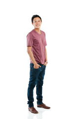 Keeping it casual in the studio. Studio portrait of a young man posing with his hands in his pockets against a white background.