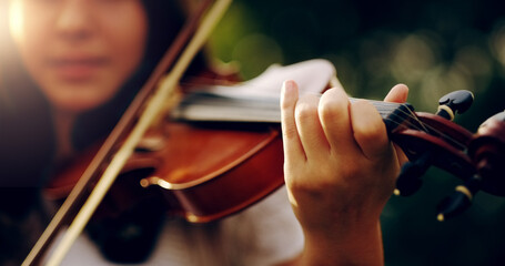 Music lifts the spirit and enlightens the soul. Cropped shot of an unrecognizable teenage girl playing a violin outside. © Lyndon S/peopleimages.com