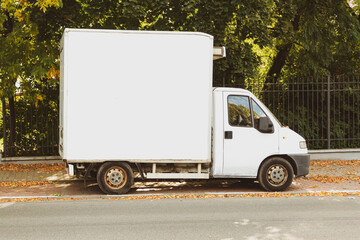 An old cargo van parked on a city street