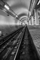 Empty underground commuter subway tunnel tracks