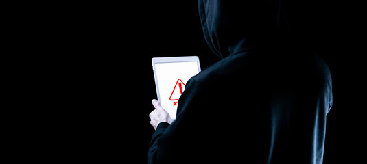 Hacker tablet cyber security. Digital mobile phone in hacker man hand isolated on black banner....
