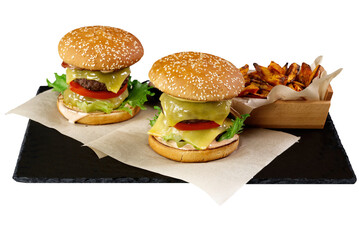 two Big burgers and sweet potato isolated on black stone plate. white background. close up