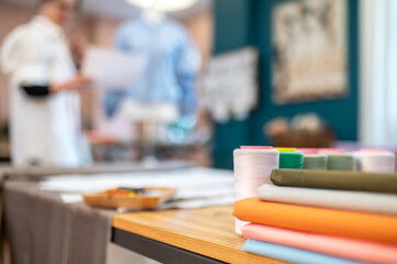 Fabric and threads lying on table
