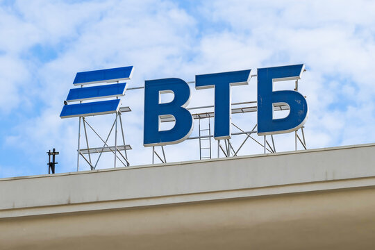 The logo of the Russian bank VTB on the roof of the building. VTB bank logo against a cloudy sky. Copy space. Moscow, Russia - July 17, 2019