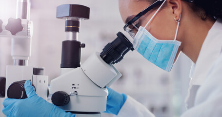 Theres always something new to discover under the lens. Shot of a young scientist using a microscope in a lab.