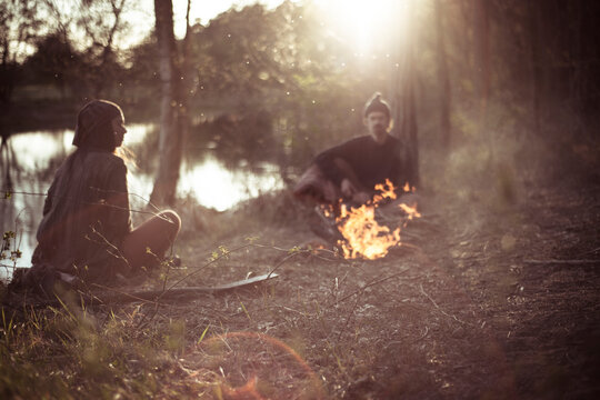 waterside fire with friends in spring afternoon