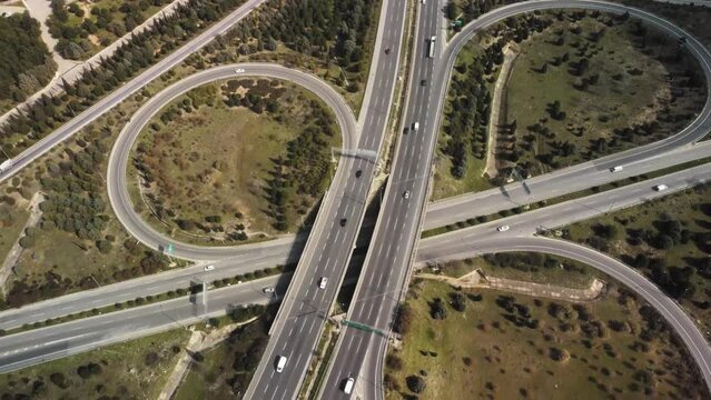 Aerial view of highway junctions with roundabout. Bridge roads shape circle in structure of architecture and transportation concept. Top view. Izmir Turkey. High quality 4k footage