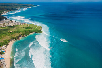 Aerial view of waves for surfing. Perfect ocean waves in Bali