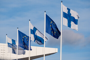 Closeup of five flags waiving in the wind. European Union flag. Flag of Finland