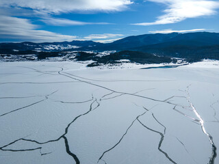 Aerial winter view of Batak Reservoir covered with ice, Bulgaria