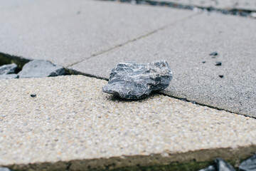 Rock with cement concrete. Garden path of paving slabs in the garden Floor panels. Photographed in close range.