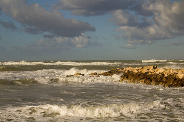 Photo from the cliff in winter with rough sea and sky with clouds in Abruzzo Italy. Adriatic Sea
