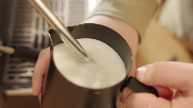 milk is foamed to later dump it into cup