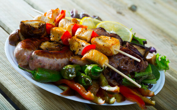 Plate of dish bulgarian cuisine meshana scara with different grilled meat and vegetables