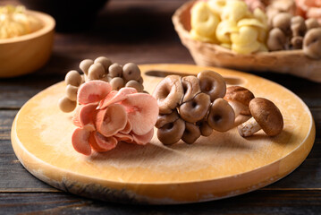 Mixed fresh mushroom (Edible mushroom) on wooden board prepare for cooking