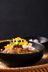 Northern Thai food (Khao Soi), Spicy curry noodles soup with coconut milk and beef, Local Thai food