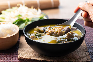 Thai food, Green curry chicken in bowl eating by spoon