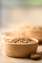Whole wheat grain in wooden bowl, Food ingredients