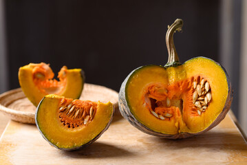 Asian pumpkin on cutting wooden board prepared for cooking, Organic vegetables from local market