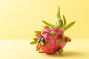 Fresh dragon fruit or pitaya on yellow background, Tropical fruit