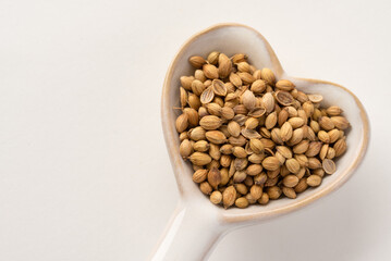 Coriander Seeds on a Heart Shaped Spoon