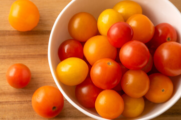 Red, Yellow, and Orange Tomatoes in a Bowl