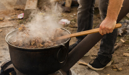 Kavurma is a Turkic sheep meat dish. Pieces of meat are stewed in a large cauldron over an open...