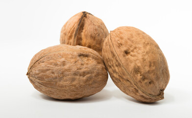 Walnuts are rounded, single-seeded stone fruits of the walnut tree.