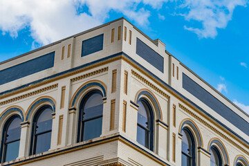 Close up old fashion brick house architecture, composed with perfect sky and clouds, texture background wall design.