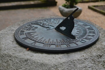 An old and vintage sundial  - obrazy, fototapety, plakaty