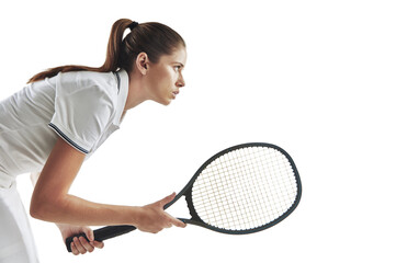 Playing tennis takes balls. Studio shot of a female tennis player holding a racket against a white...