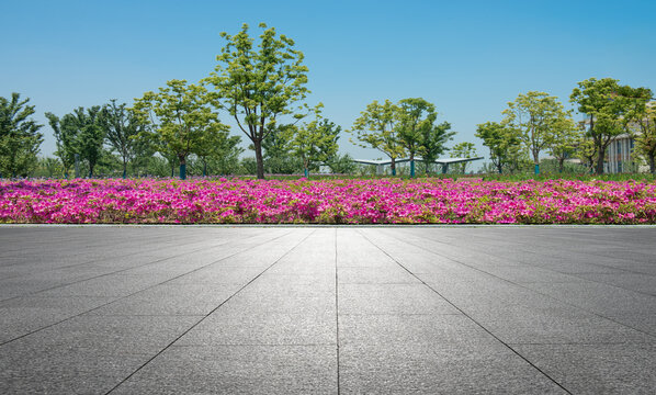 In spring, the flower beds on the side of the stone square in the park