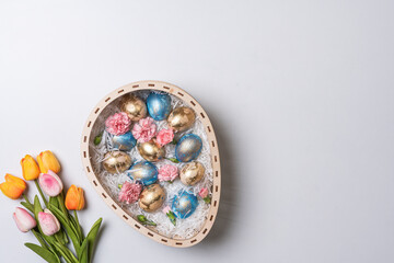 Happy easter time. Bright Easter holiday concept with spring flowers and easter eggs. Colorful Easter eggs background