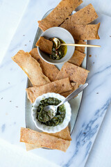 Delicious homemade pastry snacks. Homemade Sourdough Crackers with Pesto & Chimichurri Sauce....