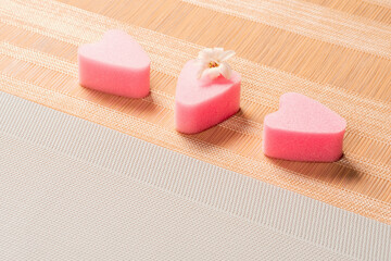Pink facial sponges with hyacinth flower. Cosmetic sponge for applying foundation on the face.