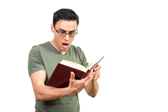 Shocked man in glasses reading interesting book