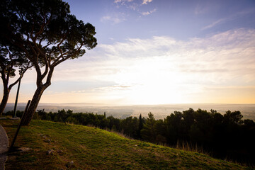 Fototapeta na wymiar Wide angle view over the beautiful Italian landscape at sunset from Castel del monte - travel photography