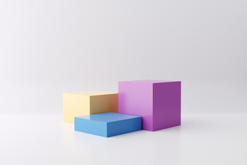 Pastel colored pedestals or platforms in cube shape with white studio background for product display.