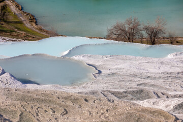 Carbonate travertines the natural pools during sunset, Pamukkale, Turkey
