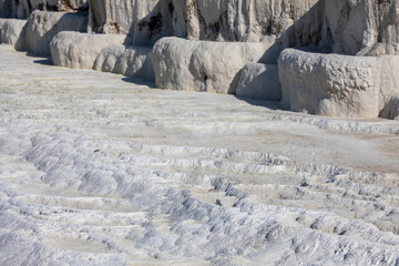 Carbonate travertines the natural pools during sunset, Pamukkale, Turkey