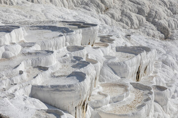 Carbonate travertines the natural pools during sunset, Pamukkale, Turkey