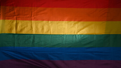 Rainbow flag as background. Pride symbol, LGBT community.