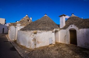 Fototapeta na wymiar Famous Trulli houses in the city of Alberobello in Italy - travel photography