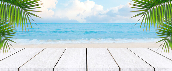 Wooden floors and sea backdrop. Wooden table top on blur blue sea and coconut leaf background in...