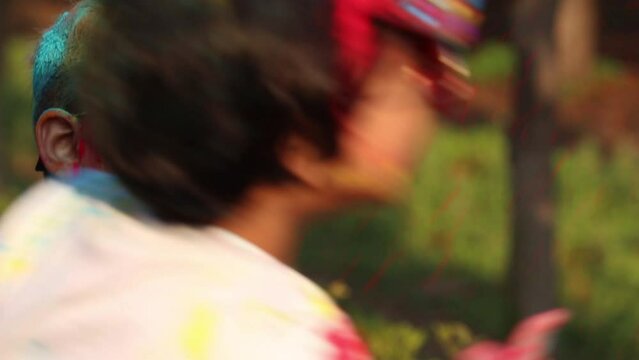 Indian Festive Theme - Happy Asian Kid Baby Boy Having Fun With Non Toxic Herbal Holi Color Powder Called Gulal Or Abir Rang Abeer During Hindu Ritual Dol Purnima. Holiday Outdoor Fun Activity