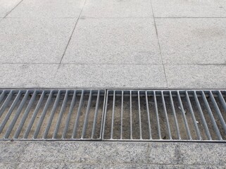 Fototapeta premium Drainage ditches on public pedestrian walkways.