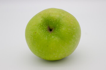 One green apple on white background