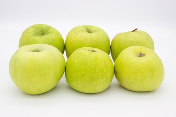 Few green apples on white background