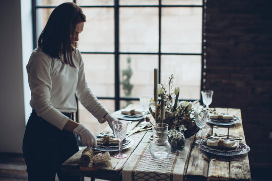 Table setting. The woman decorates the table. High quality photo